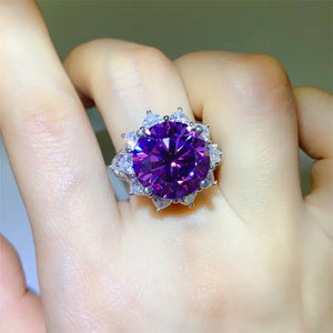 Stunning violet gemstone ring set in silver with intricate floral design, perfect for any special occasion.