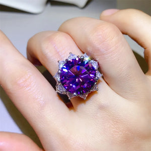 Stunning purple heart-shaped ring featuring a large gemstone surrounded by sparkling accents.