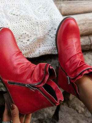Trendy red round toe block heel boots with zipper detail, perfect for stylish casual wear.
