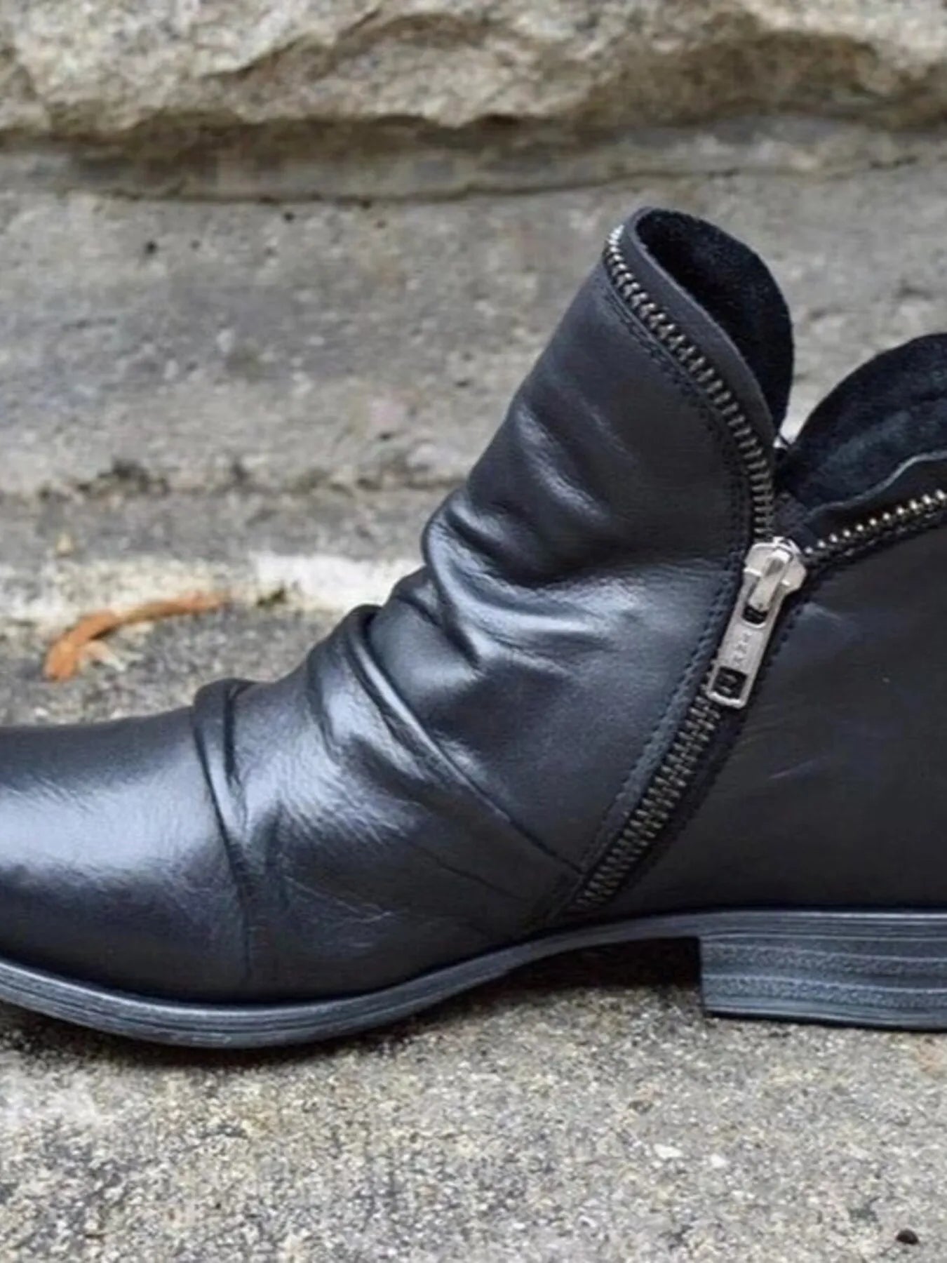 Black round toe block heel boots with side zipper and low heel design, ideal for stylish comfort.