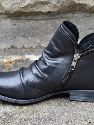 Black round toe block heel boots with side zipper and low heel design, ideal for stylish comfort.