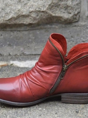 Stylish round toe block heel ankle boots in red PU leather with zipper detail.