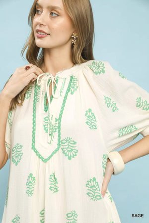 Umgee Printed Cotton Gauze Midi Dress featuring a split neckline and mint green floral print on a light background.