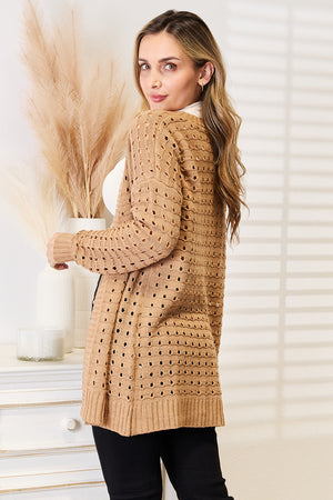 Openwork ribbed open-front cardigan in beige, showcasing its unique design and texture, perfect for layering.