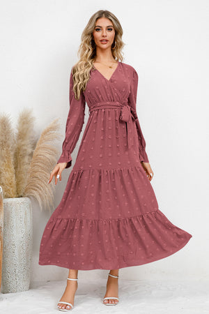 Elegant Swiss Dot Tied Surplice Flounce Sleeve Dress in dusty rose with tiered skirt and long sleeves.