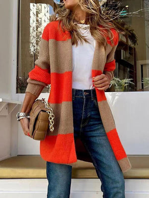 Contrast open front long sleeve cardigan in orange and beige stripes, styled with a white top and denim jeans.