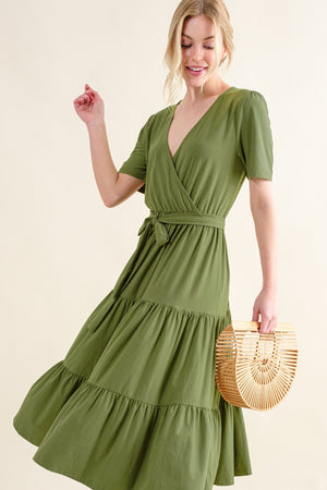 Soft short sleeve tiered midi dress in olive green, featuring a flattering wrap design and flowy silhouette.