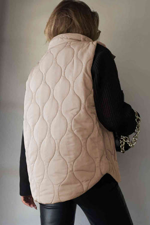 Back view of a collared neck vest with pockets, featuring a quilted design in soft beige.