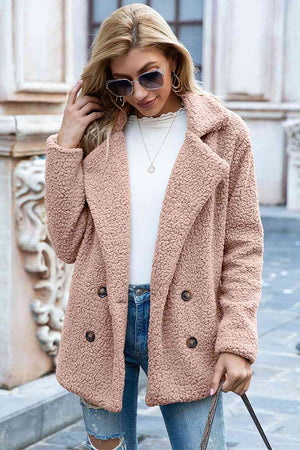 Full size lapel collar sherpa coat in soft peach color, featuring double-breasted design, styled casually with sunglasses.