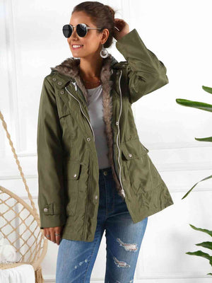 Full size hooded jacket with detachable liner, featuring pockets, in stylish green worn by a model