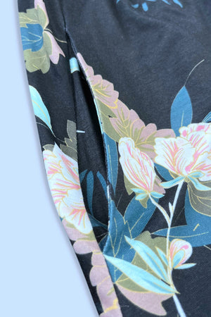 Close-up of floral print on Double Take Magic Dress showcasing vibrant colors and detailed design.