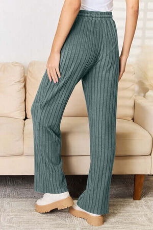 Model wearing green ribbed pants from the Basic Bae set, showcasing a stylishly cozy look.