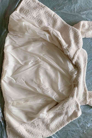 Interior view of a full size lapel collar sherpa coat showcasing the soft lining and casual style.