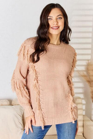 And The Why tassel detail long sleeve sweater in soft pink, featuring bohemian fringe accents and a cozy, relaxed fit.