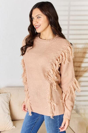 And The Why long sleeve sweater with tassel detail in soft pink, perfect for casual and dressed-up occasions.