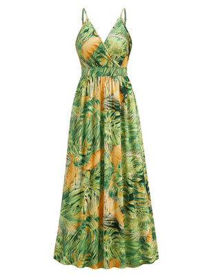 Printed surplice spaghetti strap dress with tropical green and yellow leaf print, perfect for summer outings.