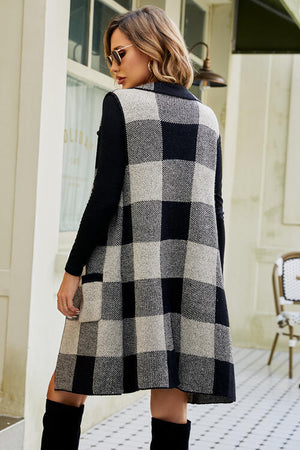 Stylish plaid open front sleeveless cardigan with pockets, featuring a black and white design, perfect for layering.