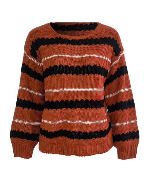 Striped round neck long sleeve sweater in orange, black, and white featuring a relaxed fit and moderate stretch.