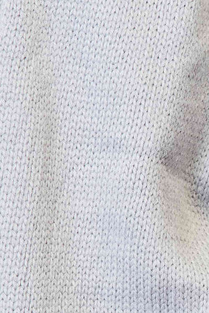 Close-up of soft, textured knit fabric in light gray tones, showcasing delicate stitching and cozy design.