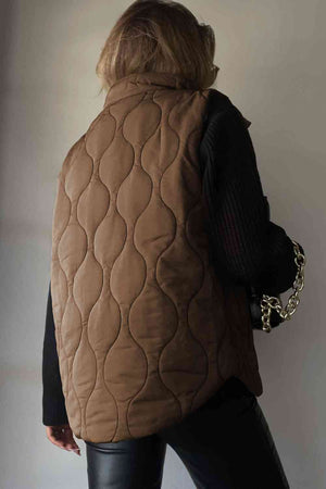 Brown collared neck vest with a quilted design and pockets, perfect for layering in cooler weather.