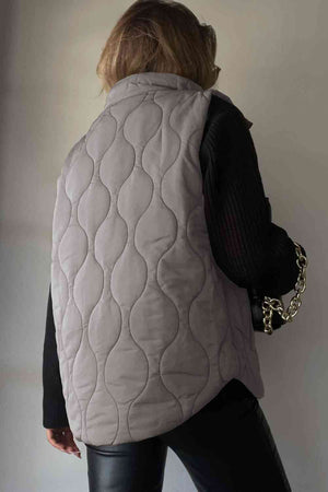 Back view of a collared neck vest with pockets in grey, featuring a quilted design and stylish look.