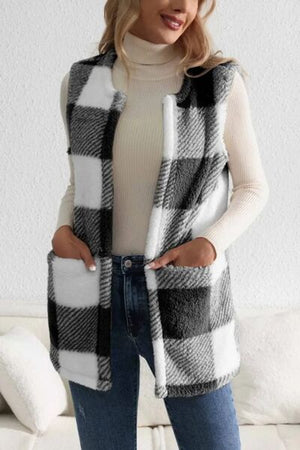 Sherpa plaid open front vest coat in black and white, worn over a turtleneck, paired with jeans for a stylish look.