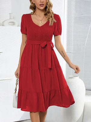 Smocked tie front short sleeve tiered dress in red, perfect for casual outings and summer events.