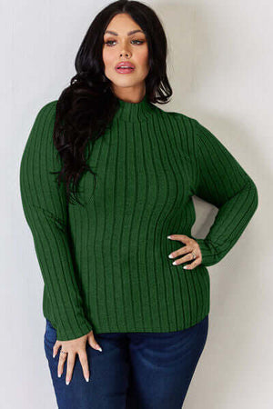 Model wearing a green ribbed mock neck long sleeve t-shirt, showcasing its stylish fit and design.