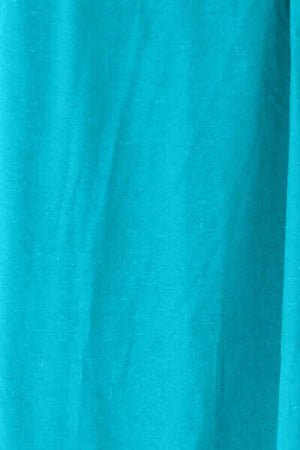 Close-up of teal fabric showing texture, ideal for stylish apparel and cover-ups.