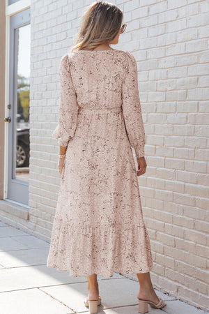 Back view of a Printed Tie Front Ruffle Hem Dress, showcasing its elegant design and flowing silhouette.