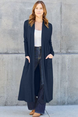 Basic Bae full size open front long sleeve cover up in navy with pockets, styled over a white top and flared jeans.