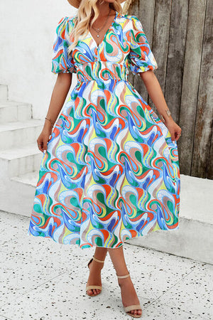 Colorful smocked printed v-neck short sleeve dress, perfect for summer outings and casual gatherings.