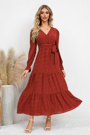 Elegant Swiss Dot Tied Surplice Flounce Sleeve Dress in rich rust color, perfect for fall or special occasions.