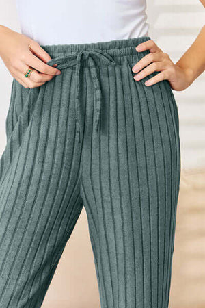 Close-up of cozy ribbed green pants with drawstring, part of the Basic Bae Hood Top & Pants Set.