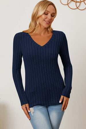 Model wearing a Basic Bae navy ribbed long sleeve V-neck t-shirt, showcasing a stylish and comfortable fit.