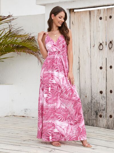 Printed surplice spaghetti strap dress in pink tropical print, perfect for summer fashion and beach outings.