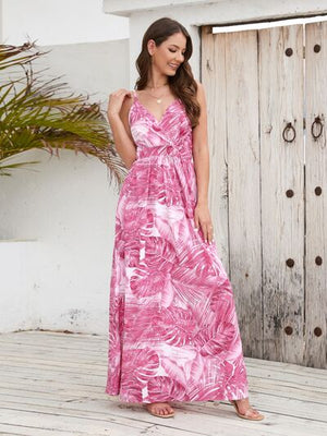 Printed surplice spaghetti strap dress in pink tropical print, perfect for summer fashion and beach outings.
