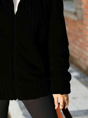 Black zip-up collared ribbed jacket featuring a relaxed fit and stylish design, perfect for casual outings.