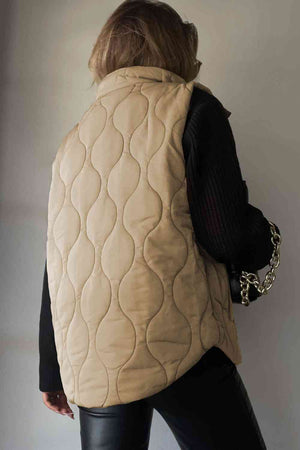 Back view of a beige collared neck vest with quilted design, showcasing pockets and stylish look.