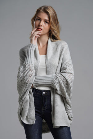 Model wearing a Double Take Dolman Sleeve Open Front Longline Cardigan in light gray with ribbed trim.