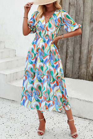 Colorful smocked printed V-neck dress with short sleeves, perfect for summer outings and casual events.