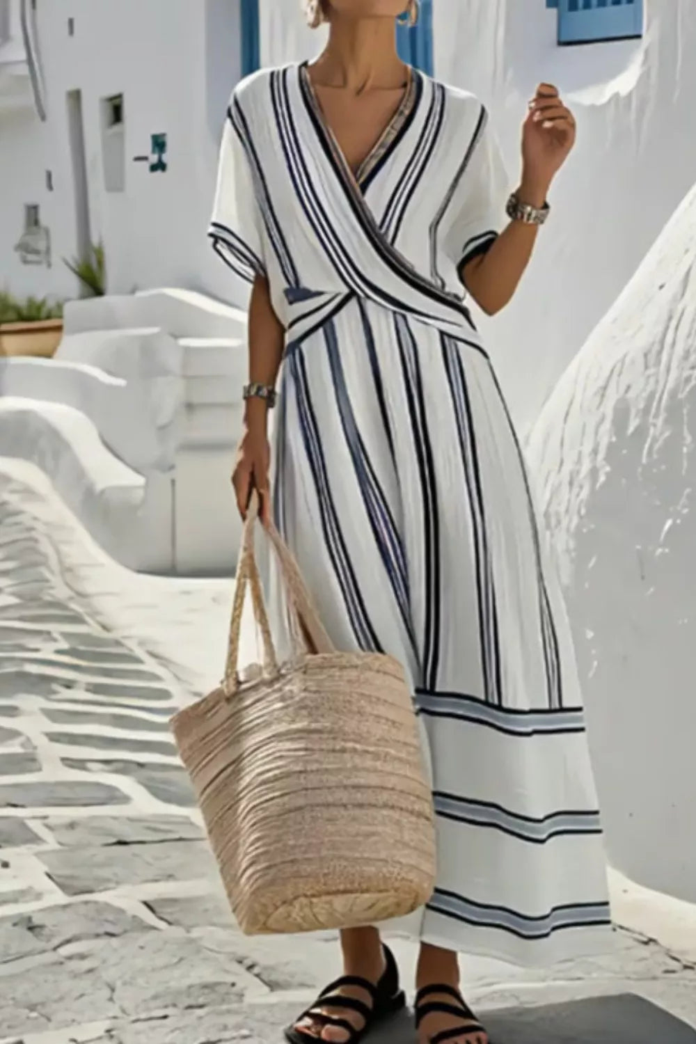 Model wearing Striped Wrap Half Sleeve Maxi Dress with a woven bag, perfect for summer outings.