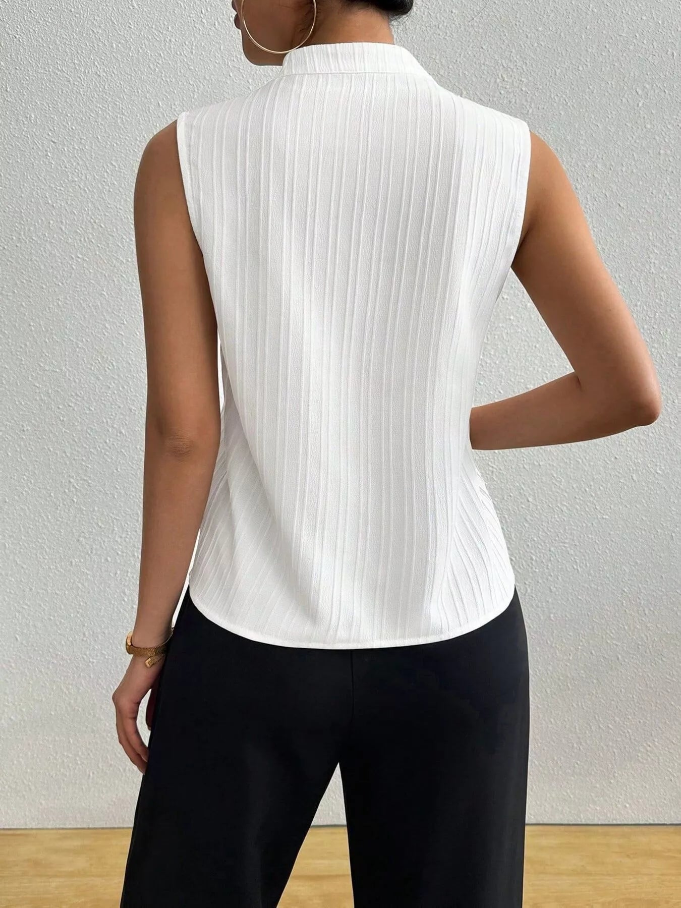 Back view of Texture Notched Sleeveless Top showcasing its ribbed design and elegant fit.