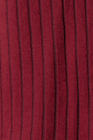 Close-up of ribbed fabric in rich burgundy, showcasing a textured design with vertical stripes.