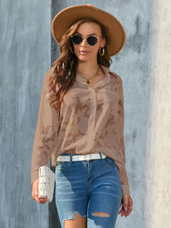 Full Size Collared Neck Long Sleeve Shirt Plus Size styled with jeans and accessories in a fashionable outdoor setting.