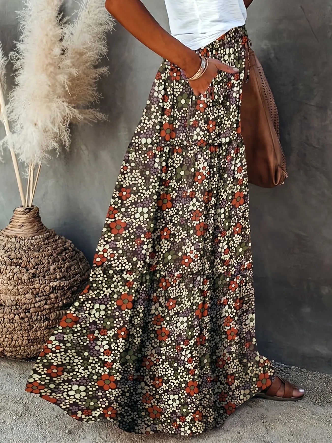 Floral print maxi skirt in a bohemian style, featuring vibrant hues and a flowy design, perfect for casual summer outings.