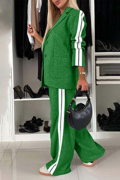 Stylish green lapel collar top and pants set with white stripes, perfect for a chic, casual look.