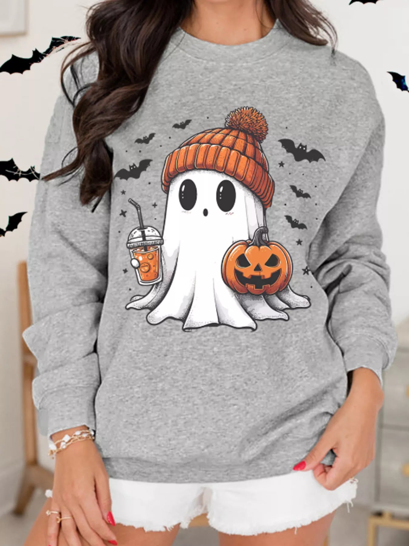 Halloween ghost sweatshirt with pumpkin and drink design, perfect for spooky season style, gray fabric.