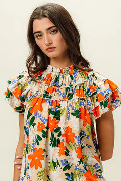 BiBi Multi Color Floral Print Woven Top featuring vibrant floral design, frill details and ruffled sleeves.