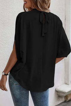 Tie Back Slit Half Sleeve Blouse in black, featuring a tied back and slit design, perfect for stylish comfort.